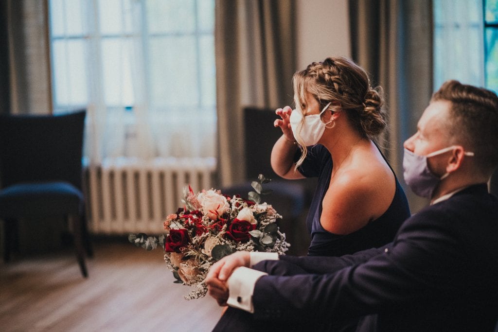 Wedding guest wipes away tears
