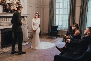 Bride laughs as groom reads out vows