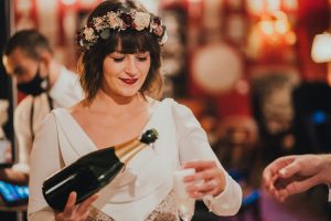 Bride pours champagne