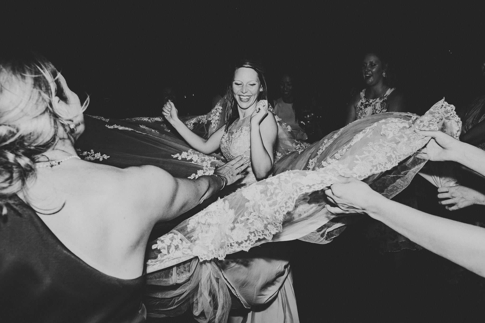 bride dancing in the ring of guests