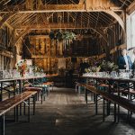 the inside of the barn set up for the wedding