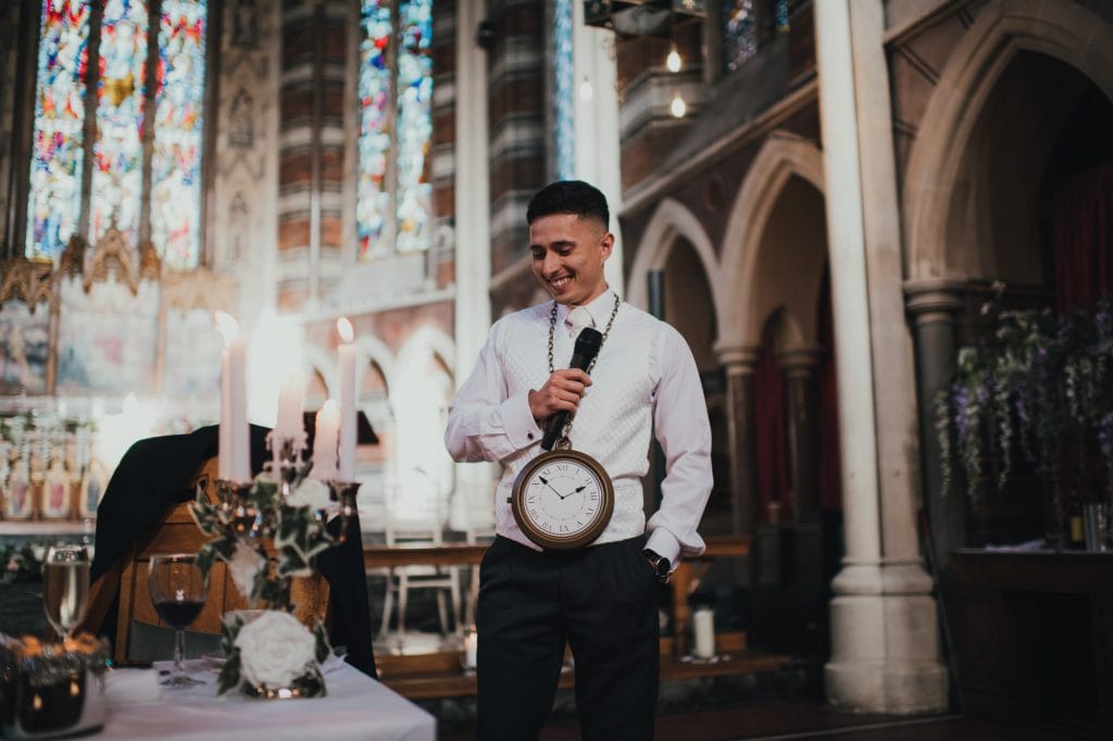 groom doing his speech wearing novelty clock