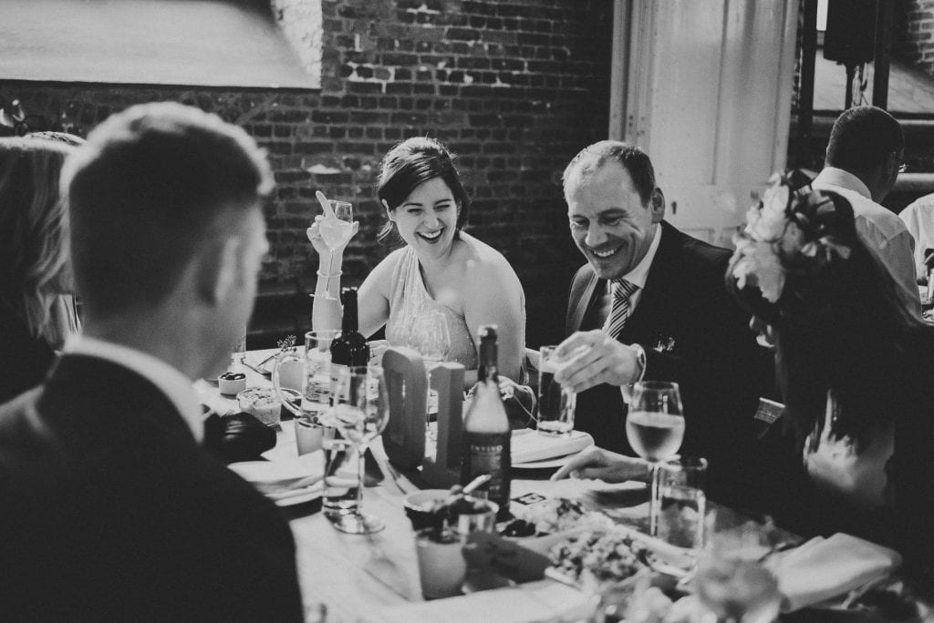 guests laughing over food