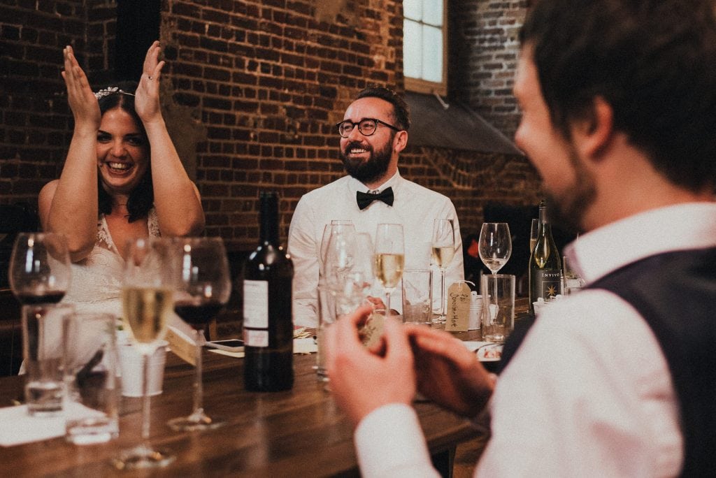 groom laughing at speech