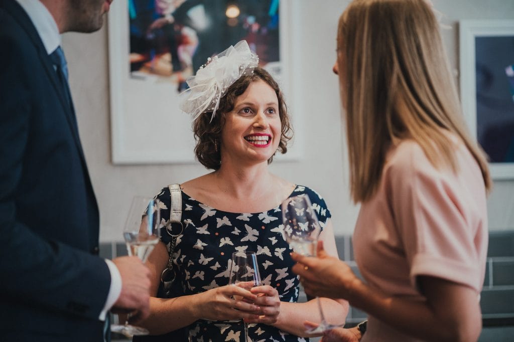 a wedding guest smiling