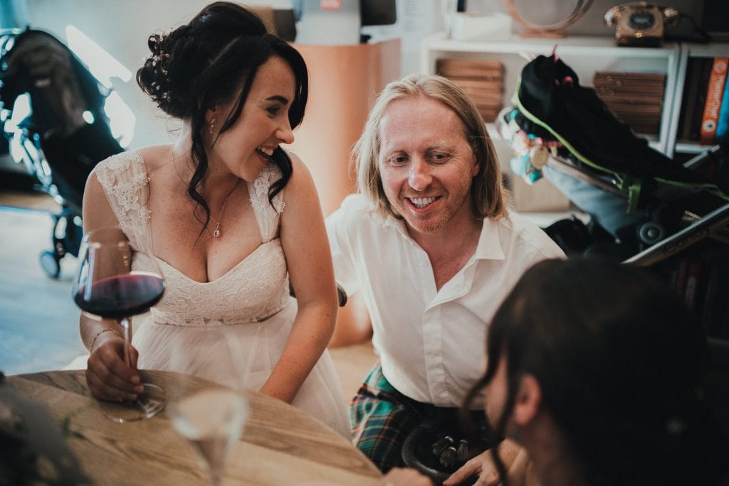 the bride laughing with guests