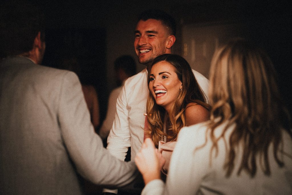 wedding guests laughing on dancefloor