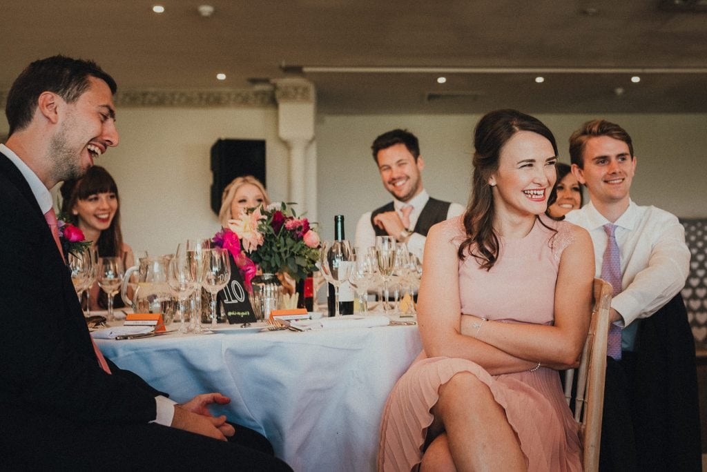 table of guests laughing