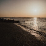 whitstable beach as the sun sets