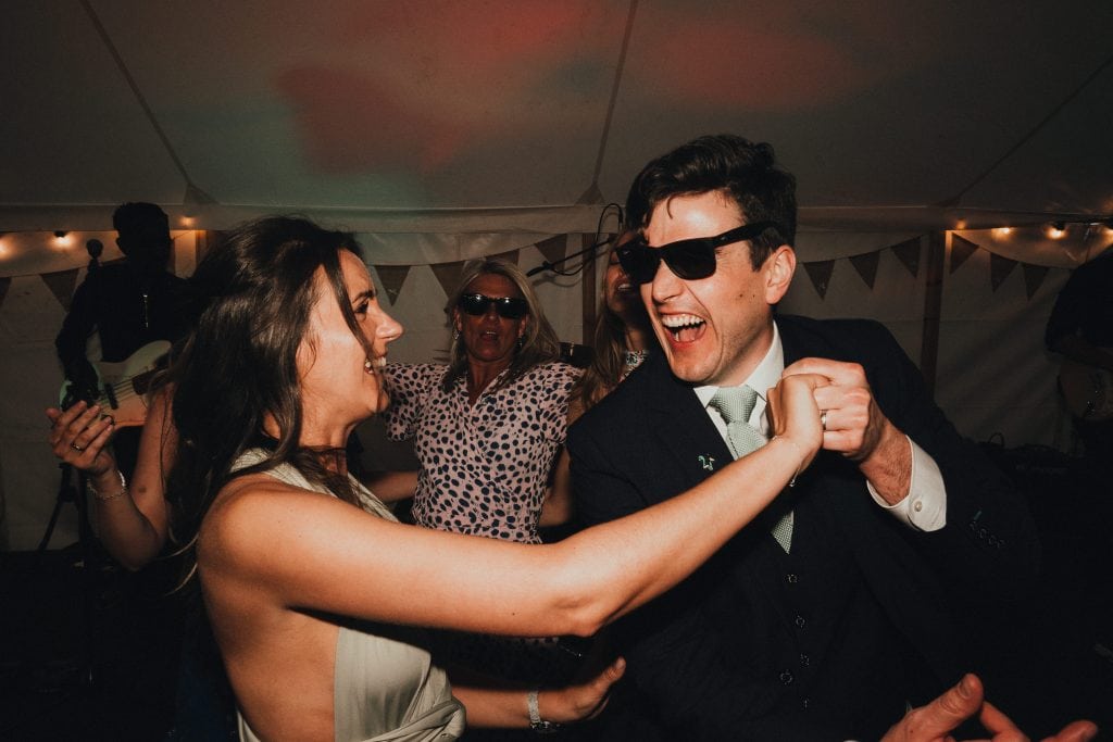 guests dancing in sunglasses