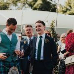 the best man laughing at the groom's speech