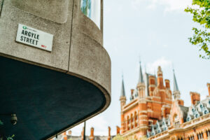 Argyle Street sign, historical architecture in background, London.