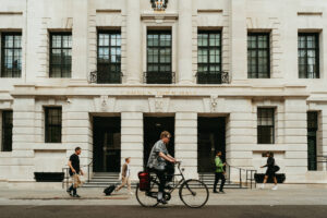 People walking past Camden Town Hall, London.