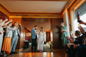 Indoor celebration toast with smiling couple.