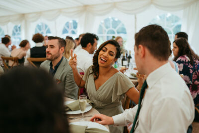 Joyful conversation at a wedding reception.