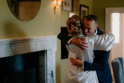 Two people hugging in a warmly lit room