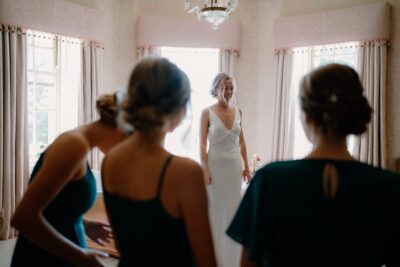 Bride in wedding dress with bridesmaids