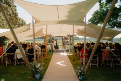 Outdoor wedding ceremony under a canopy