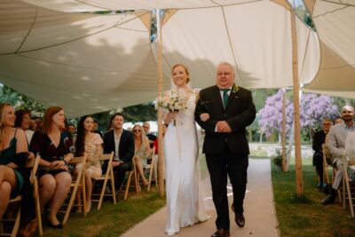 Bride walking down the aisle with father.
