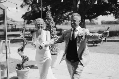 Happy couple celebrating at outdoor wedding venue