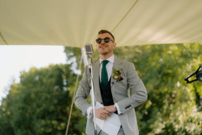 Man in suit giving outdoor speech