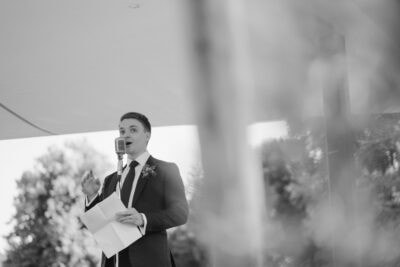 Man giving a speech at outdoor event