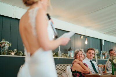 Bride giving speech at wedding reception