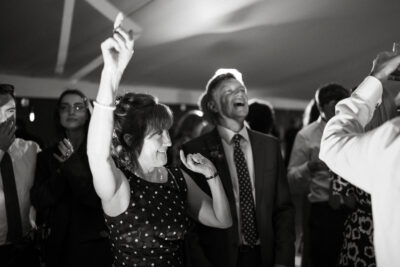 Guests dancing at black-and-white wedding reception.