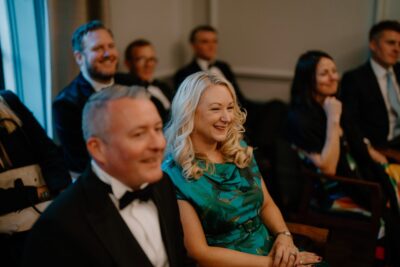 Guests smiling at formal event gathering