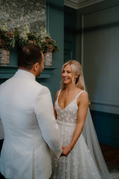 Bride and groom smiling during wedding ceremony