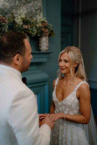 Couple exchanging rings at wedding ceremony