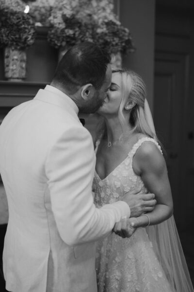 Bride and groom sharing a kiss.
