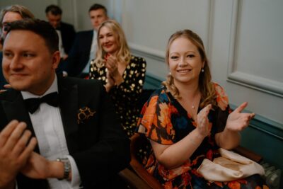 Audience clapping at an event.