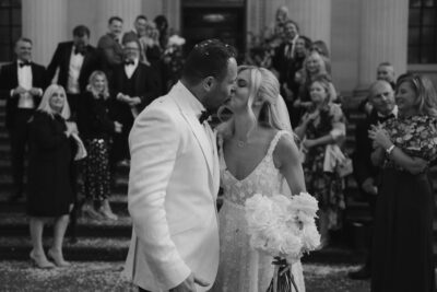 Bride and groom kiss after wedding ceremony