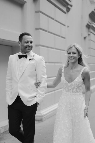 Bride and groom walking happily together