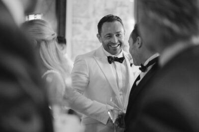 Smiling man in tuxedo at social event