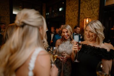 Women socialising at elegant evening event