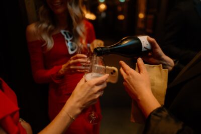 Pouring champagne at party gathering