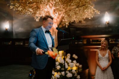 Man giving speech at wedding reception