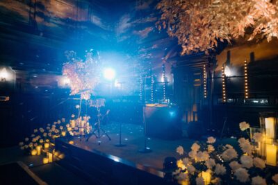 Elegant event stage with flowers and candles