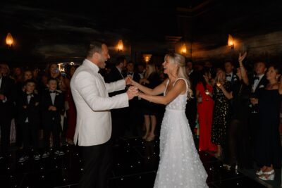 Bride and groom dancing at wedding reception.