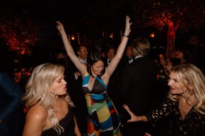 People dancing at a lively nighttime party.