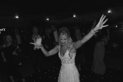 Woman dancing at party in elegant dress