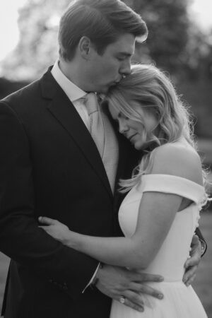 Couple embracing during romantic moment, black and white