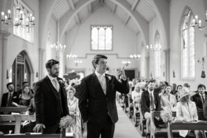 Groom and best man in church at wedding ceremony.