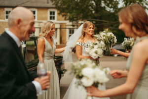 Bride and bridesmaids with bouquets at wedding