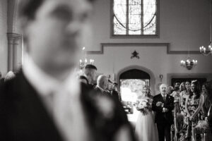 Wedding ceremony in church, black and white photograph.