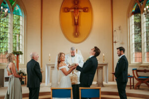 Wedding ceremony in a church with bride and groom.