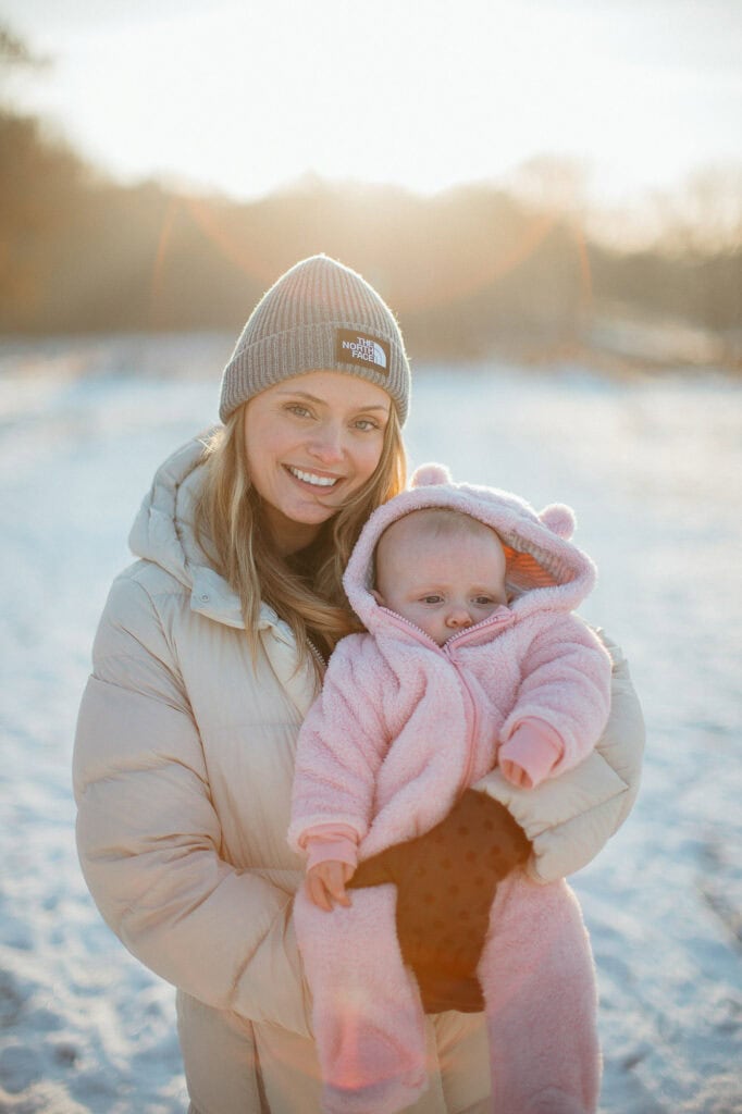Woman and baby in winter sunlight.