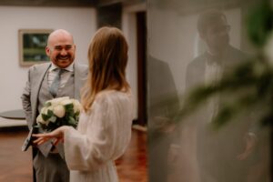 Bride and groom smiling during wedding ceremony